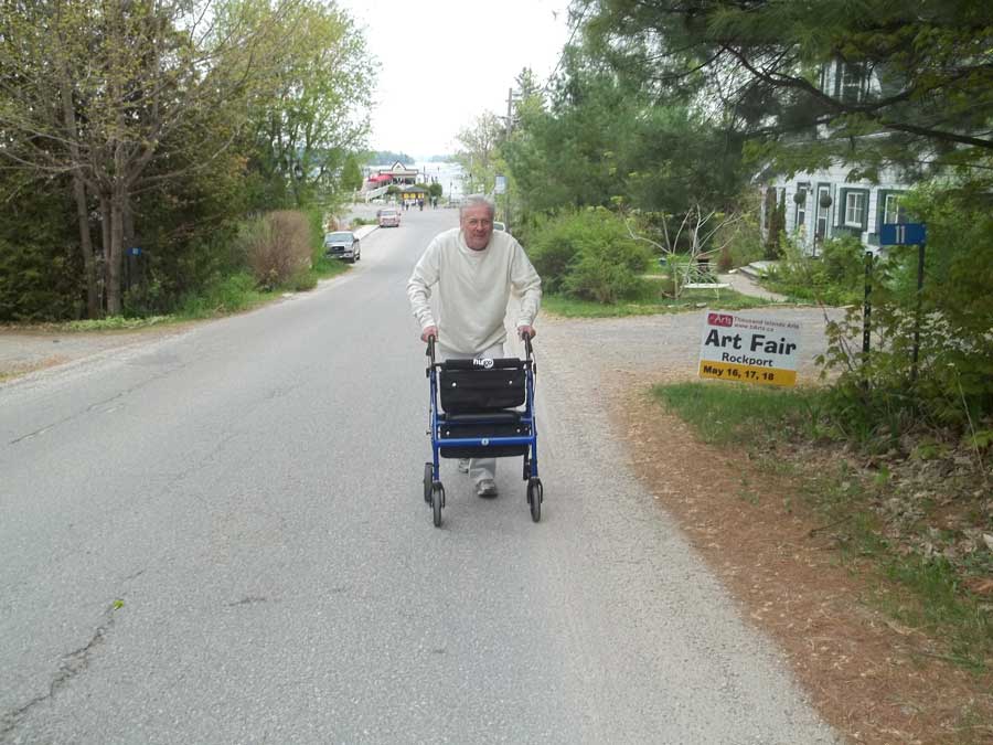 Climbing in Rockport on Gananoque tour with Bob Hardy and his blue Hugo Elite rollator walker