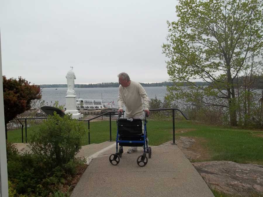 Touring Gananoque with Bob Hardy and his blue Hugo Elite rollator walker
